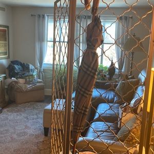 Vintage Burberry long umbrella with checkered pattern.